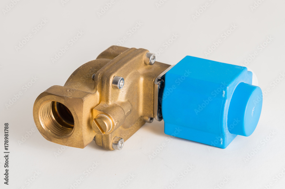 a new magnetic electro valve on a gray background a new magnetic electro valve on a gray background