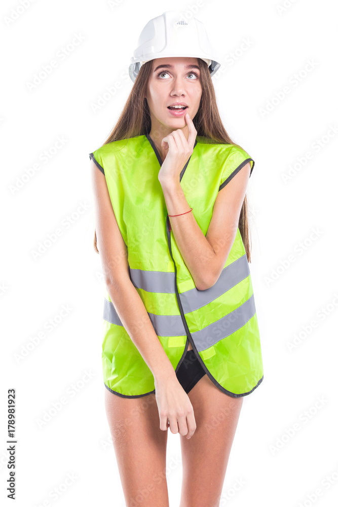 studio portrait of a girl in a bathing suit and a yellow construction vest