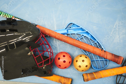 Floorball equipment - Goalkeeper helmet, stick and balls photo