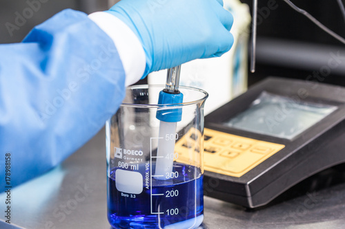 Scientist using a ph meter at laboratory