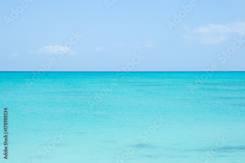 A perfect horizon line between turquoise sea water and blue sky. Caribbean, Turks and Caicos Islands.  © ShyLama Productions