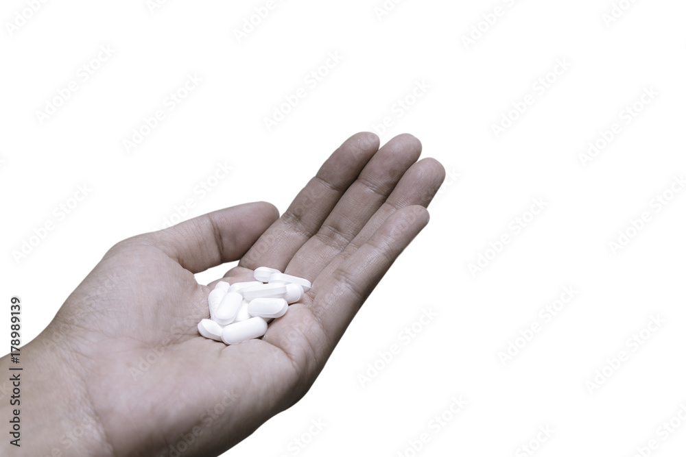 People is holding tablets medicine in the hand isolated on white background, health concept. People is holding tablets medicine in the hand isolated on white background, health concept.