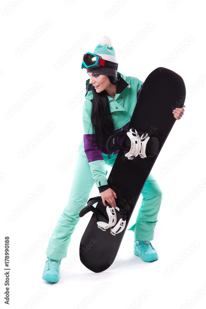 young pretty woman in purple ski costume hold snowboard young pretty woman in purple ski costume hold snowboard