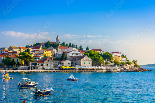 Primosten tourist resort Croatia. / Seafront colorful view at Primosten town in Croatia, Adriatic Coast scenery. photo