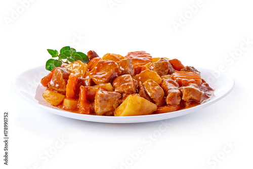 Goulash, beef stew with potatoes, isolated on white background