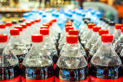 plastic bottles with soft drinks background