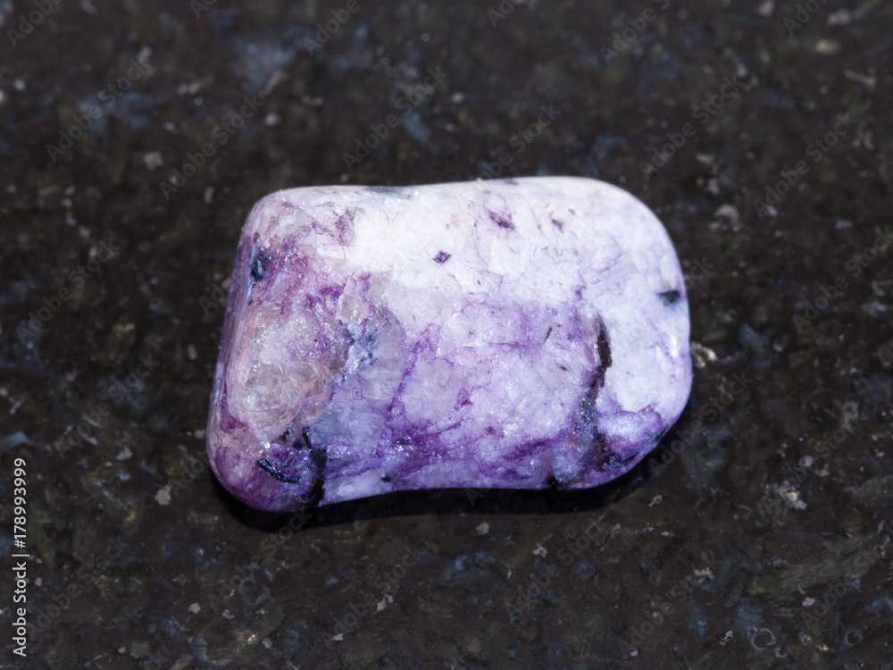 polished Amethyst gemstone on dark background polished Amethyst gemstone on dark background