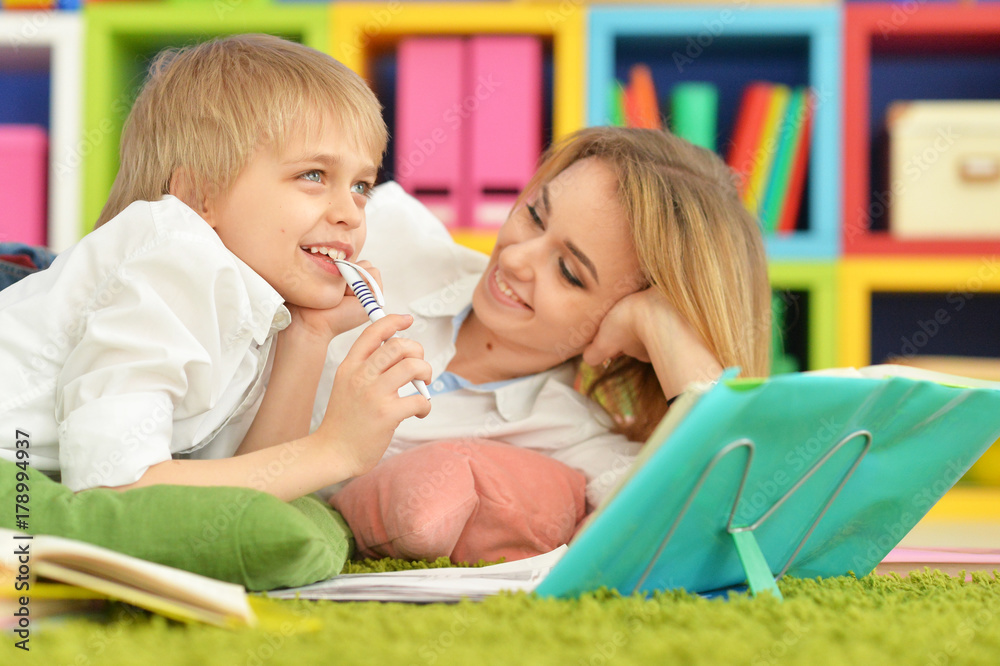 Mother with her son doing homework Mother with her son doing homework