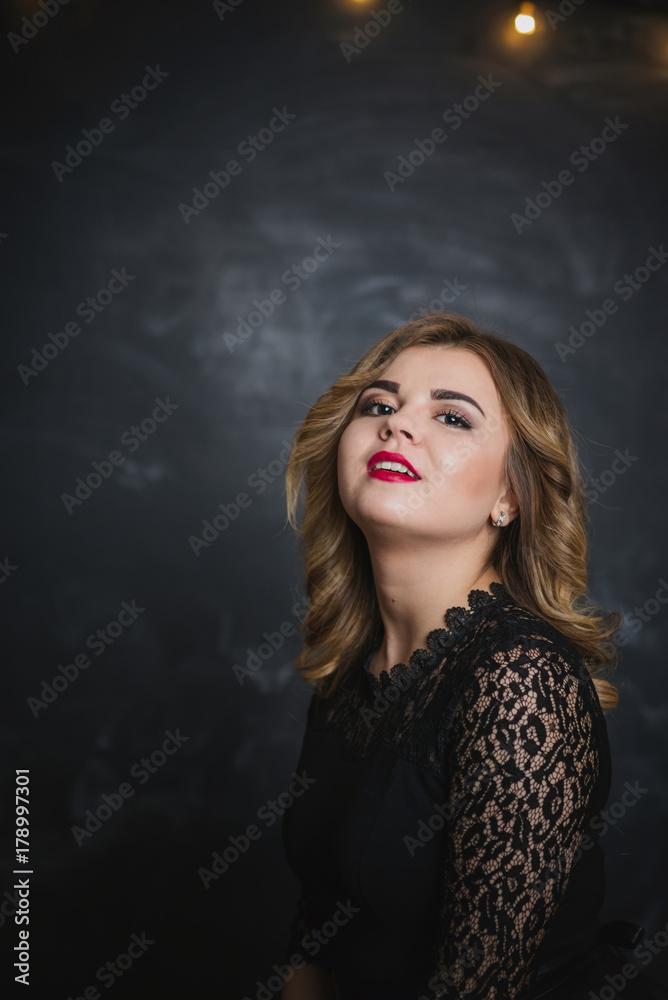 portrait of a blonde on a black background portrait of a blonde on a black background