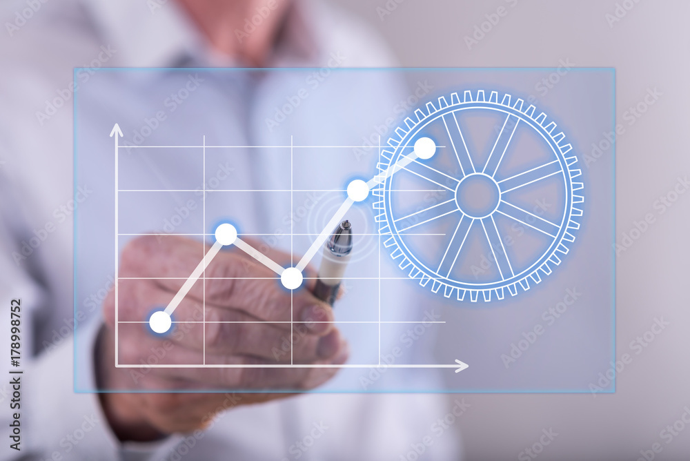 Man touching a digital business analysis concept on a touch screen Man touching a digital business analysis concept on a touch screen