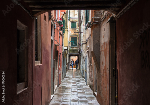People in the end of a narrow venetian street, Venice