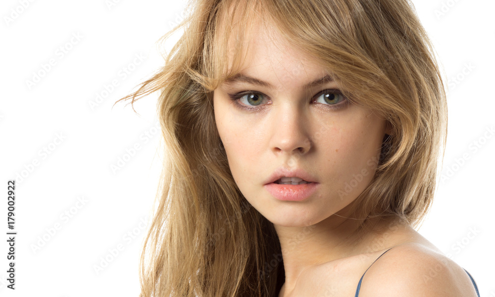 Beautiful blond young woman in a pink dress. Isolated on white. Beautiful blond young woman in a pink dress. Isolated on white.