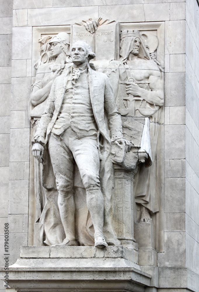 Close up of 'Washington accompanied by Wisdom and Justice' (by Alexander Stirling Calder) located on the arch entrance of Washington Square Park.