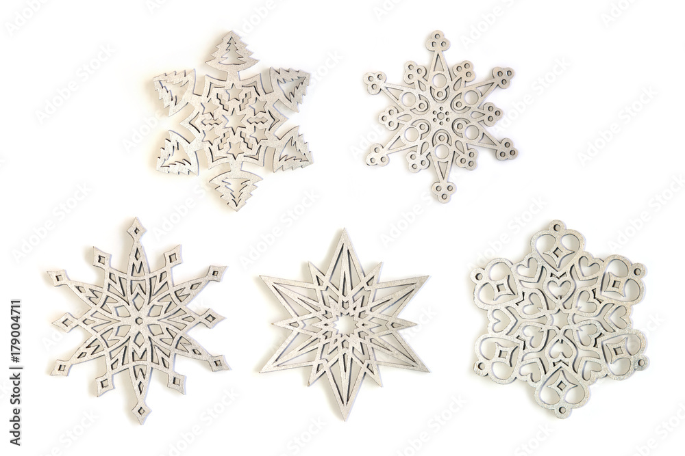 Silver snowflakes ornaments isolated on white background. Set of five different silver snowflakes. Silver snowflakes ornaments isolated on white background. Set of five different silver snowflakes.