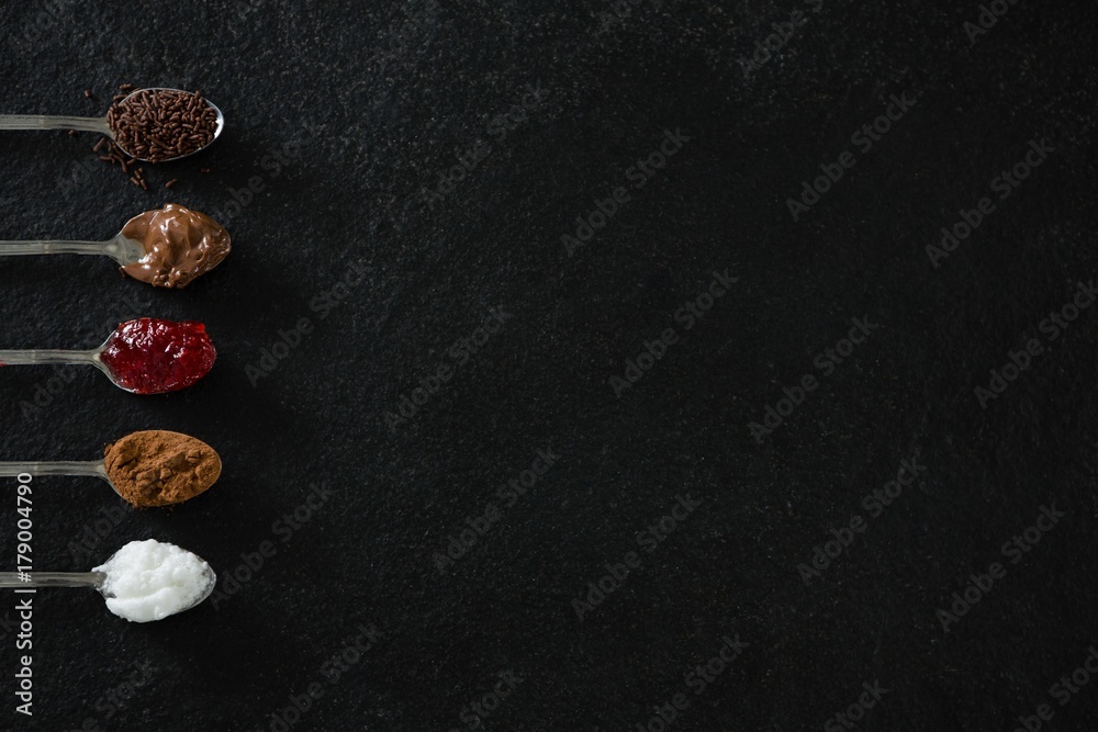 Various cookies seasoning ingredients in spoon Various cookies seasoning ingredients in spoon