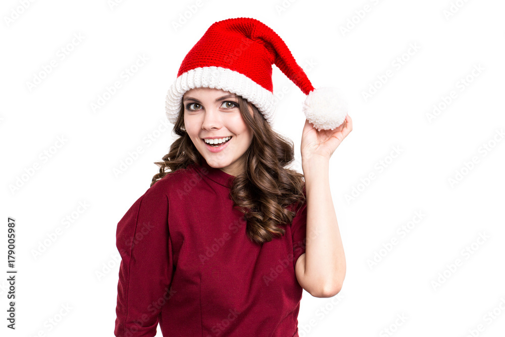 Emotional girl in santa hat isolated on white background. Emotional girl in santa hat isolated on white background.