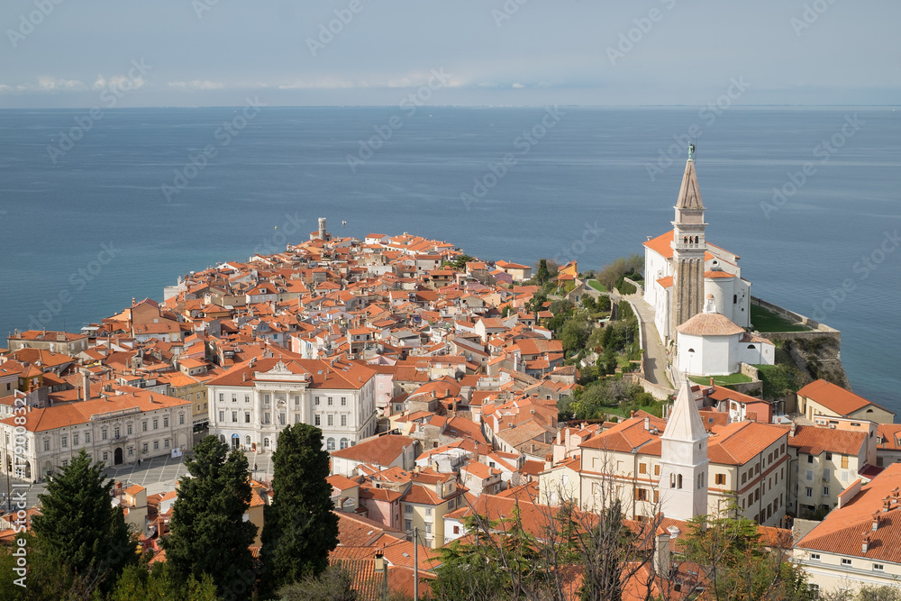 Piran is a city on Adriatica sea. The view from on top of the red tiled roofs of the houses.