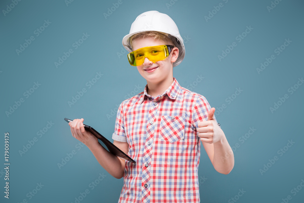blonde teenager blonde in the construction helmet with a screwdriver and hammer blonde teenager blonde in the construction helmet with a screwdriver and hammer