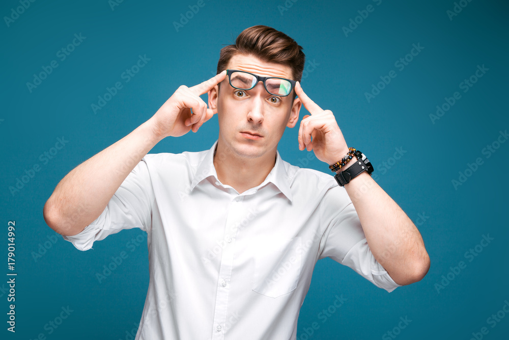 Handsome mature businessman in costly watch, black glasses and white shirt Handsome mature businessman in costly watch, black glasses and white shirt
