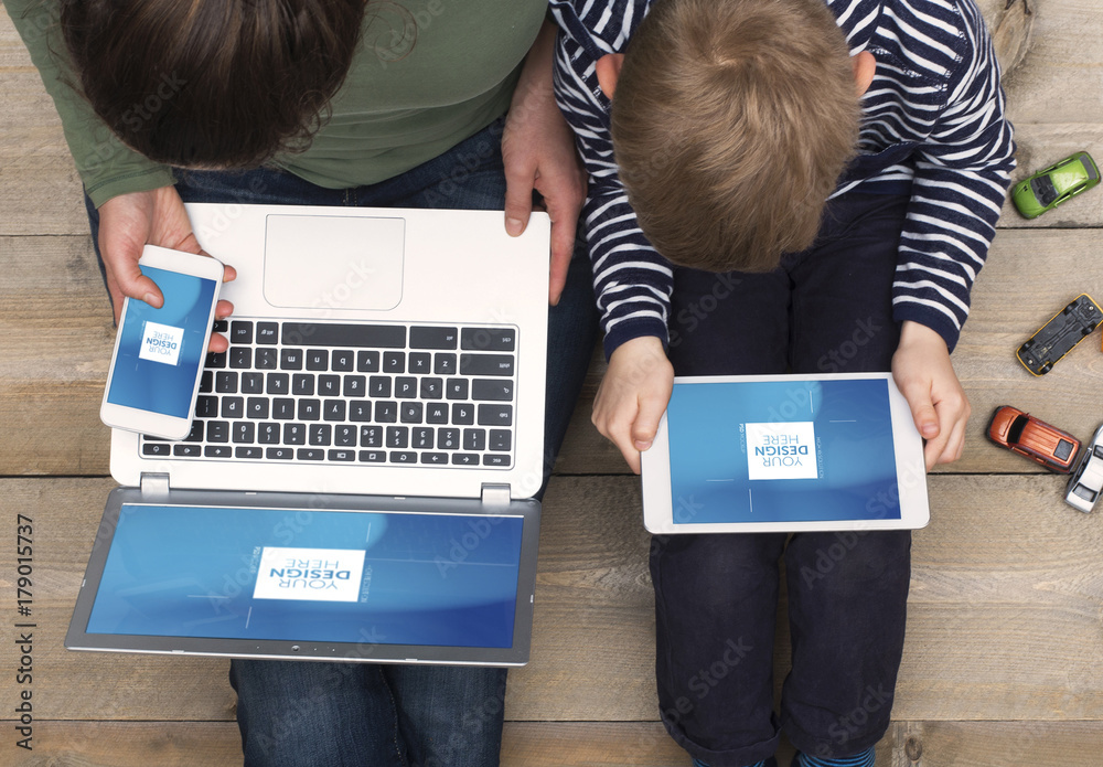 Φωτογραφία Top View Mockup of Mother and Son Sitting on Floor with Devices 2