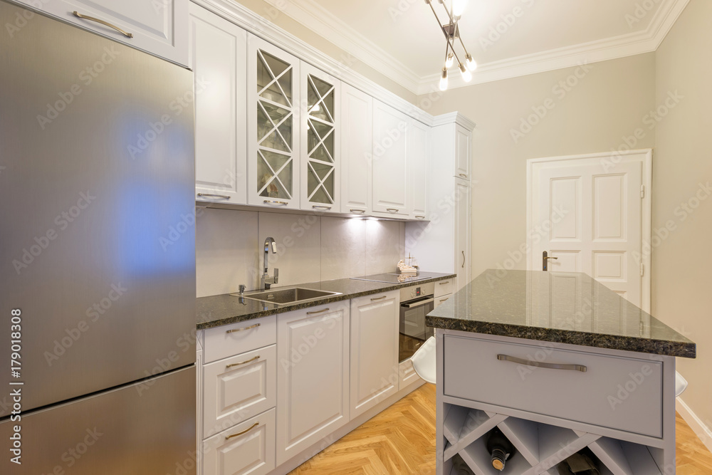 Kitchen interior in new apartment with kitchen island Kitchen interior in new apartment with kitchen island
