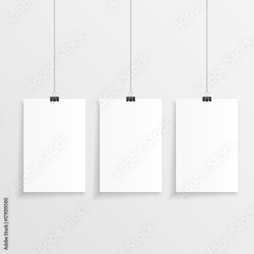 Realistic hanging paper set with three step and clips. Vector illustration of three blank papers with space for text in front of a wall.