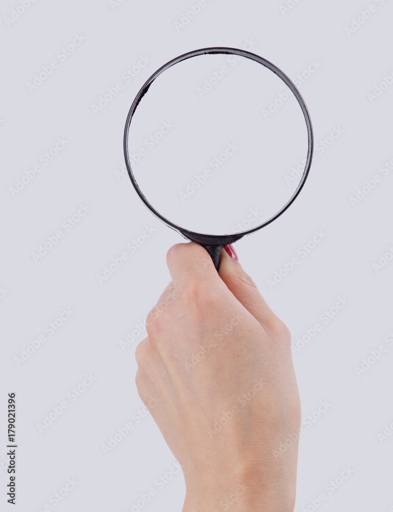 Magnifying glass in hand