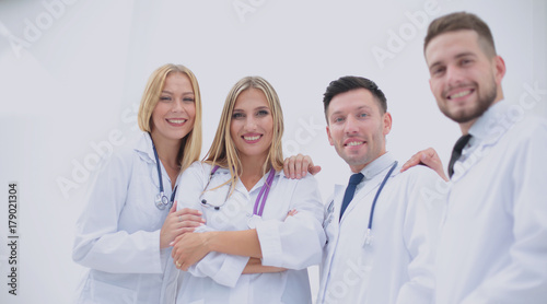 Happy and confident team of doctors posing on camera