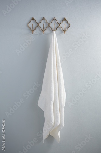 White towel hanging on hook