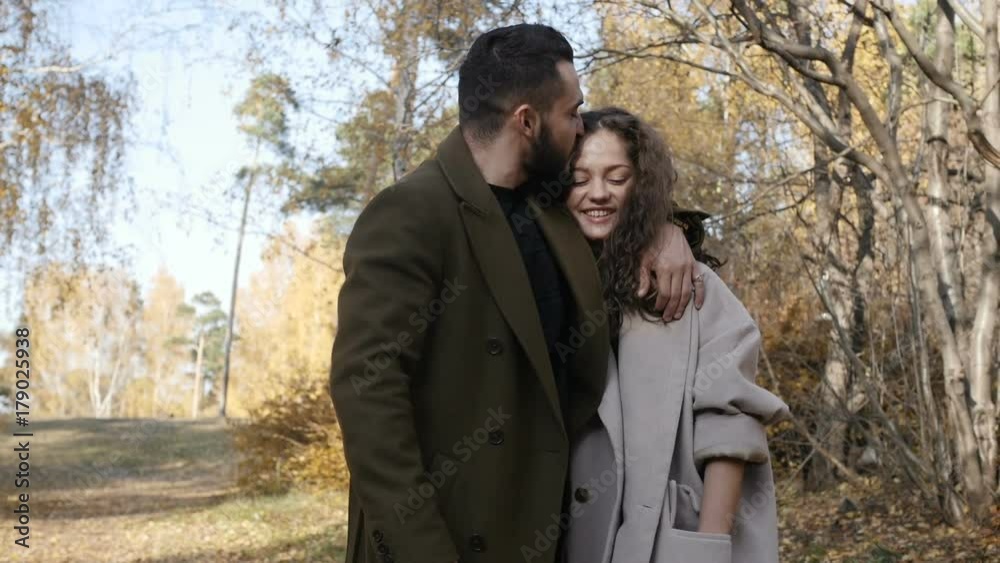 Couple walking in autumn park Couple walking in autumn park