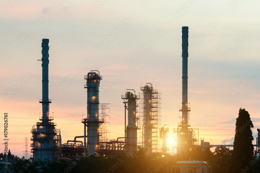 Landscape of oil refinery industry with oil storage tank in night.