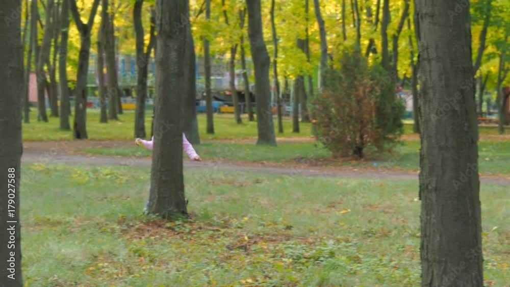 Happy family in autumn park. Happy child with mom playing in the park. Happy family in autumn park. Happy child with mom playing in the park.