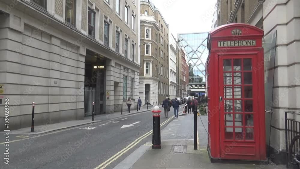 a typical London’s street and the classical red telephone booth a typical London’s street and the classical red telephone booth