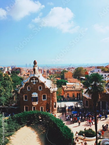 Fragments of the beautiful architecture in Park Guell. Parc Guell designed by Antoni Gaudi, is one of the world's most intriguing parks. Carmel Hill, Barcelona, Spain. photo
