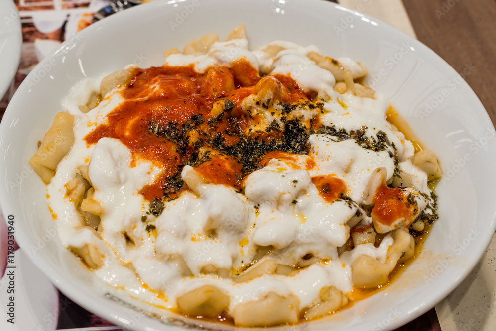 Turkish Manti Manlama with yogurt and fried butter sauce Turkish Manti Manlama with yogurt and fried butter sauce