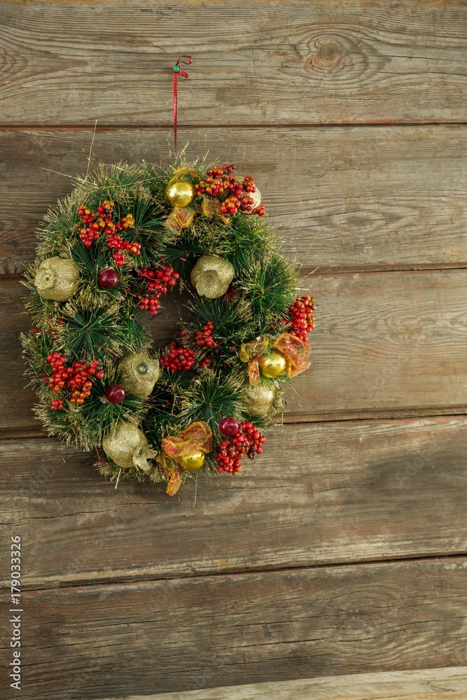 Christmas wreath against wooden background Christmas wreath against wooden background