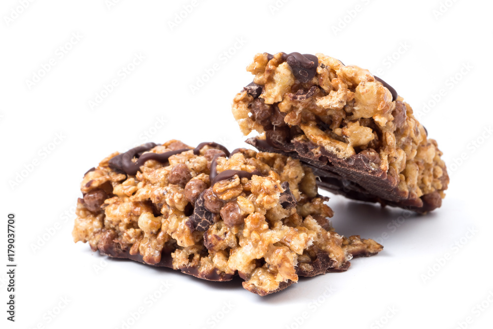 Chocolate cereal bars with wheat whole grain and chocolate on a white background. Chocolate cereal bars with wheat whole grain and chocolate on a white background.