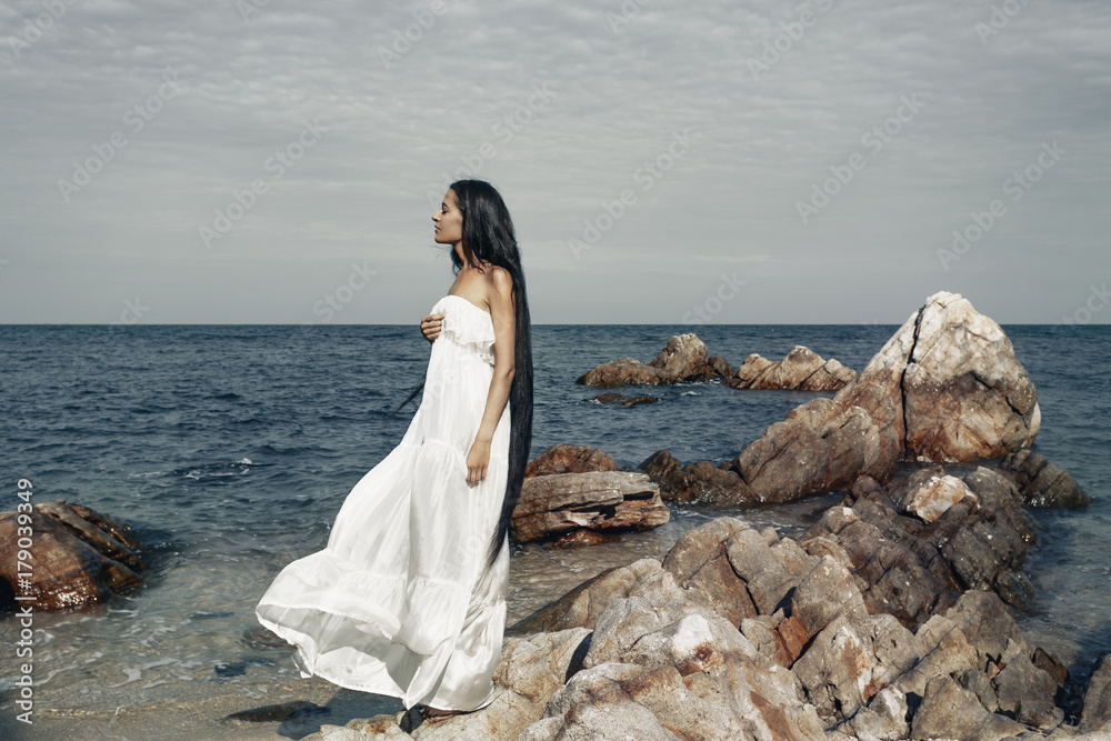beautiful young boho style woman in white dress beautiful young boho style woman in white dress