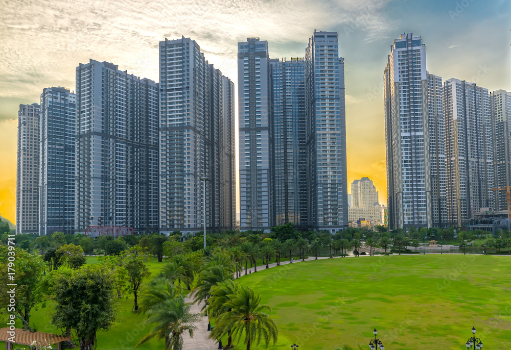 Obraz premium Ho Chi Minh City, Vietnam - November 30th, 2017: Panoramic skyscrapers at sunset with sky impressive in apartment, architectural extended life material development people in Ho Chi Minh City, Vietnam