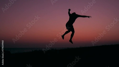 Wallpaper Mural Silhouette of Young Happy Man Running and Jumping at Beautiful Pink Sunset. HD Slowmotion Carefree Lifestyle Freedom Footage. Torontodigital.ca