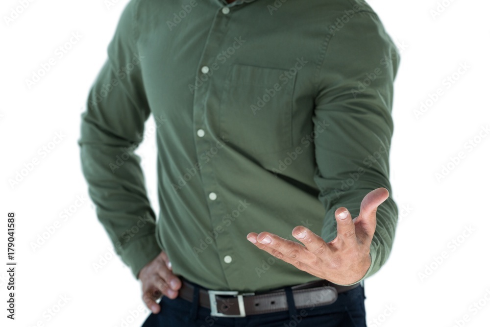 Male executive pretending to hold an invisible object Male executive pretending to hold an invisible object