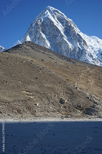 Pumori looms over Gorak Shep in the Himalayas.