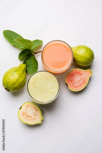 Guava  juice or Amrud drink or Smoothie with fresh Guava fruit, moody lighting selective focus

 photo