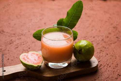 Guava  juice or Amrud drink or Smoothie with fresh Guava fruit, moody lighting selective focus

 photo