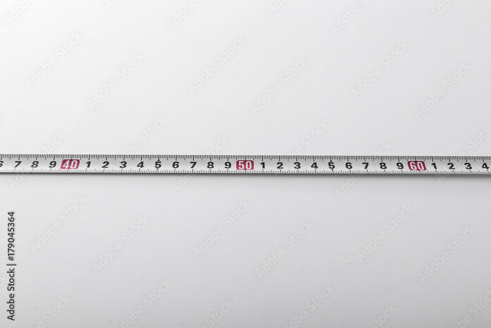 tape ruler on the white background. tape ruler on the white background.