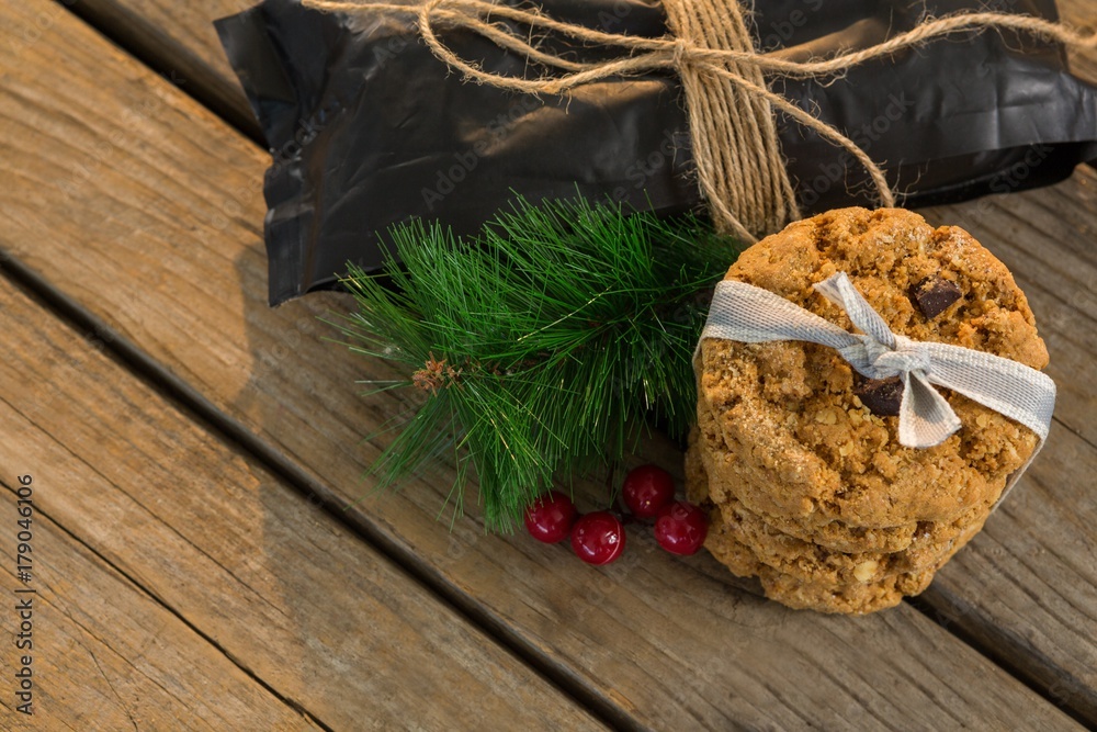 High angle view of cookies with pine needles and cheeries by High angle view of cookies with pine needles and cheeries by