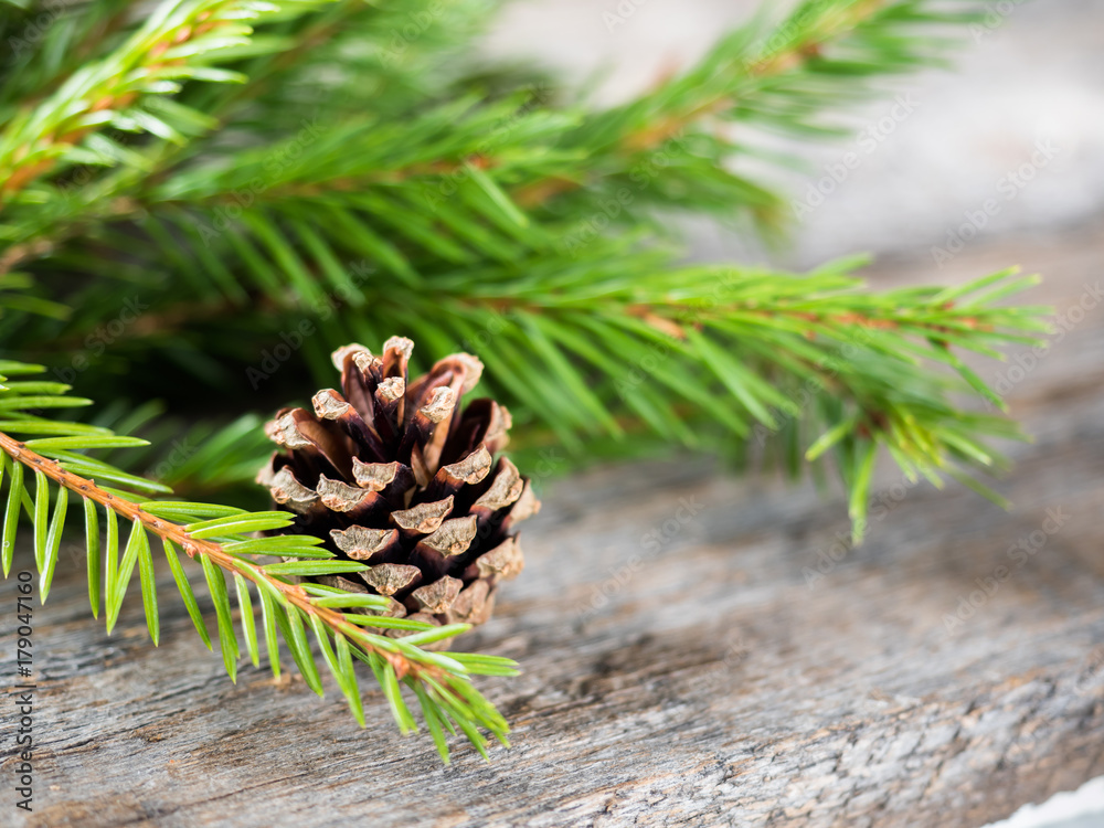 Fototapeta premium Christmas fir tree with decoration on a wooden board