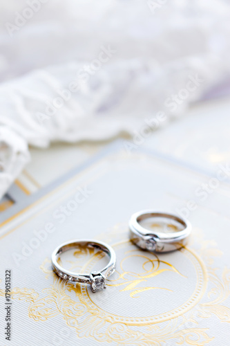 ring on wedding card with soft-focus and over light in the background