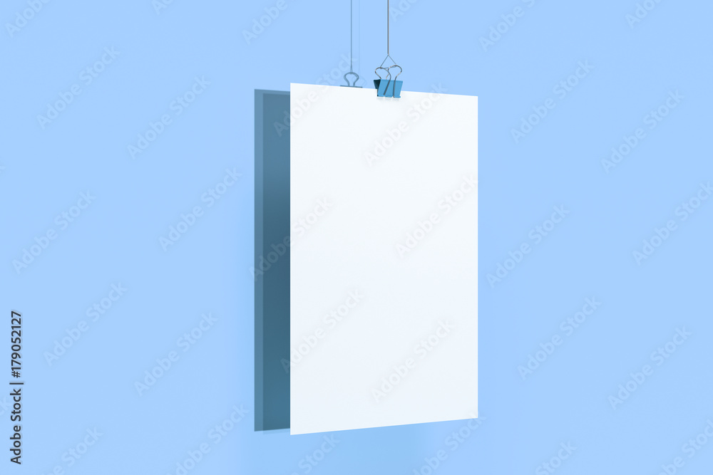 Blank white poster with binder clip mockup on blue background Blank white poster with binder clip mockup on blue background