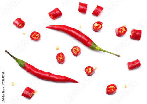 фотография sliced red hot chili peppers isolated on white background top view